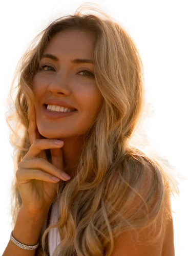 Woman with blonde hair smiling in sunlight.
